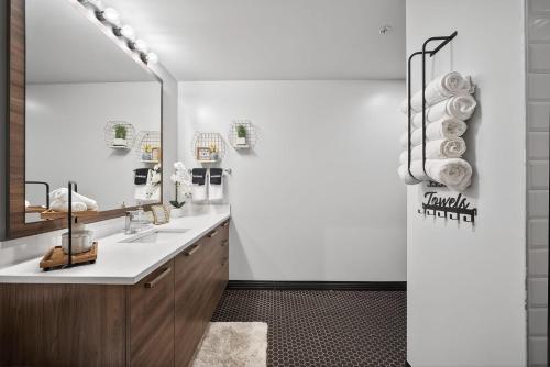a bathroom with a sink and a mirror at Urban Luxe Loft in Dallas