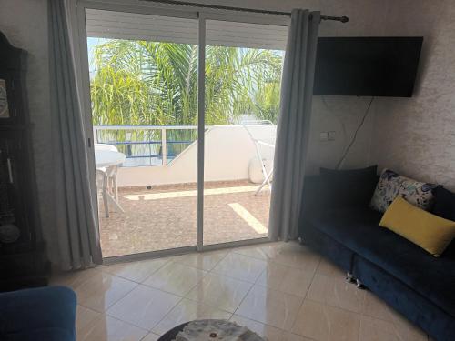 TV a/nebo společenská místnost v ubytování Oualidia résidence Ben zeroual