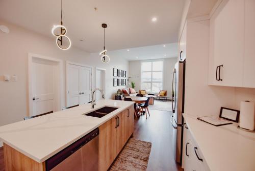 a kitchen with white countertops and a dining room at New Vaulted Ceilings 3 Beds AC Views in Golden