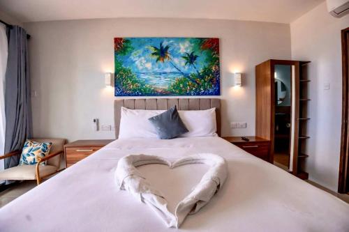 Ένα ή περισσότερα κρεβάτια σε δωμάτιο στο ZenBreak Hammock Suite CoCo-Nut