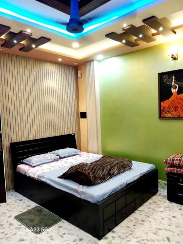 Ένα ή περισσότερα κρεβάτια σε δωμάτιο στο NEIL & NIAL Home Stay