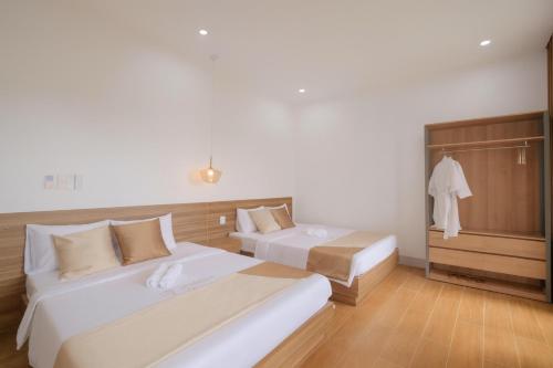 Postel nebo postele na pokoji v ubytování Trang Van Hotel Phu Quy