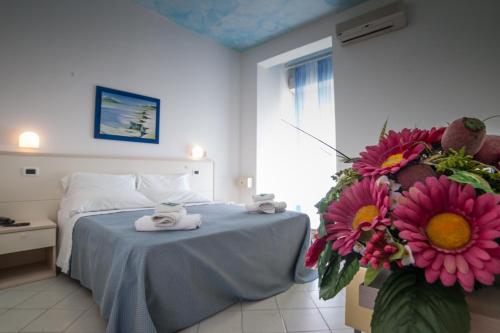 Postel nebo postele na pokoji v ubytování Hotel Caraibi