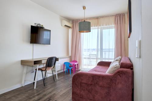 TV/trung tâm giải trí tại Konstanzer 103 - 2 camere, bucatarie, baie, parcare pazita, TV, Wi-Fi, utilat complet