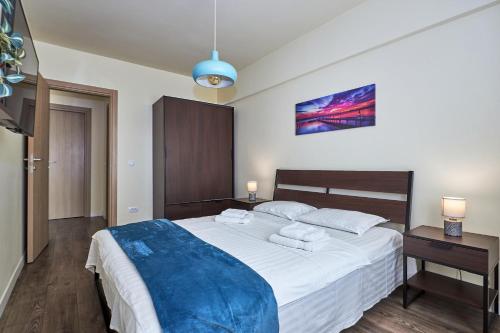 Giường trong phòng chung tại Konstanzer 103 - 2 camere, bucatarie, baie, parcare pazita, TV, Wi-Fi, utilat complet