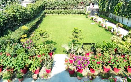 an aerial view of a garden with flowers and plants at The Olive Greens in Pāonta Sāhib