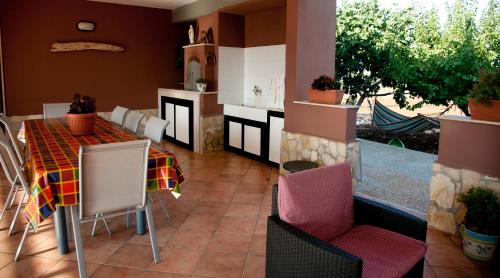 a kitchen and dining room with a table and chairs at Villa Rosalba in Polignano a Mare