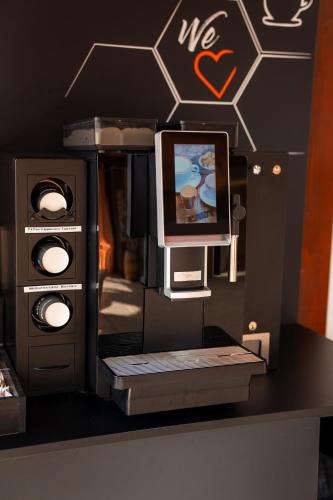 a model of a tv and a computer on a table at Hotel Hochsauerland 2010 in Willingen