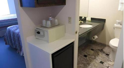 a bathroom with a sink and a toilet at Hilgard House Westwood Village in Los Angeles