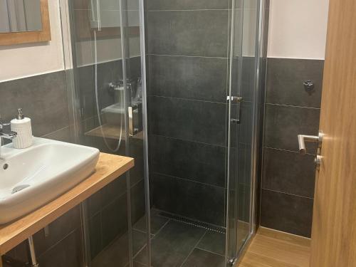 a bathroom with a shower and a sink at Apartment at the ski lift in Jochberg in Jochberg