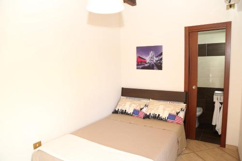 מיטה או מיטות בחדר ב-B&B Villa Caracciolo