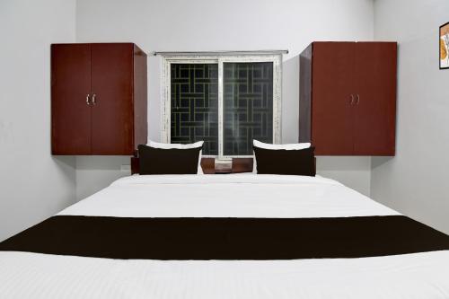 Ένα ή περισσότερα κρεβάτια σε δωμάτιο στο Hotel O Ayesha Palace