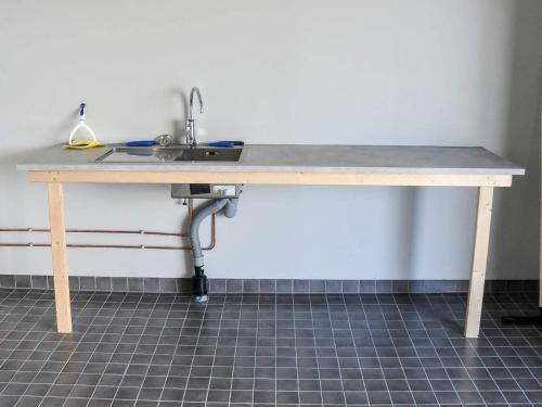 a kitchen counter with a sink and a sink at 6 person holiday home in Dyrvik in Dyrvik