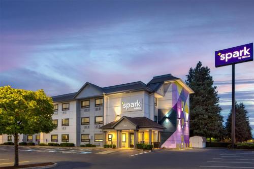 a hotel building with a sign in front of it at Spark by Hilton Springfield Eugene in Eugene