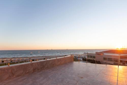 a view of the ocean from the balcony of a building at Ramada by Wyndham Baku in Baku