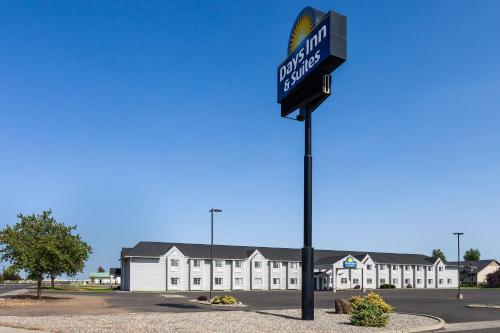 a street sign on a pole in a parking lot at Days Inn & Suites by Wyndham Spokane Airport Airway Heights in Airway Heights