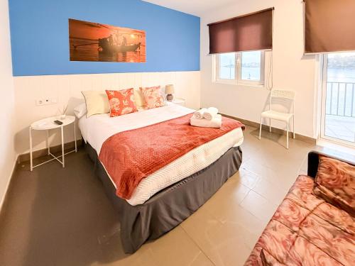 Ένα ή περισσότερα κρεβάτια σε δωμάτιο στο Sanxenxo Playa Alojamientos