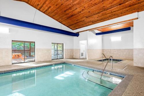 an indoor pool with a wooden ceiling at La Quinta by Wyndham Boone in Boone
