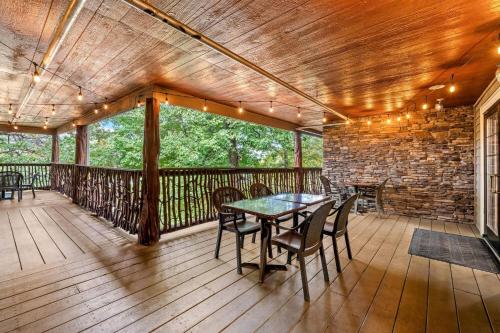 a patio with a table and chairs on a wooden deck at La Quinta by Wyndham Boone in Boone