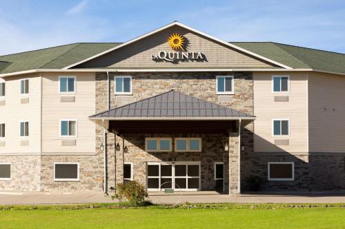 a hotel with a sun sign on the front of it at La Quinta by Wyndham Fairbanks Airport in Fairbanks