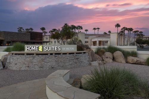 a home suites sign in front of a building at Home2 Suites by Hilton Scottsdale Old Town in Scottsdale