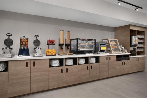 a store with a counter with food on it at Home2 Suites by Hilton Scottsdale Old Town in Scottsdale