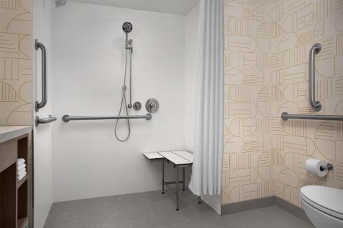 a bathroom with a shower and a toilet at Home2 Suites by Hilton Scottsdale Old Town in Scottsdale