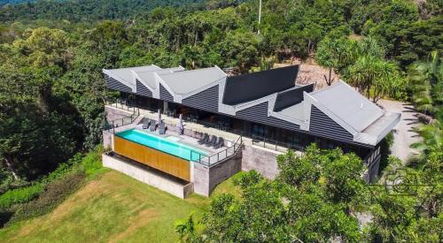 an aerial view of a house with a swimming pool at The Cassowary - Luxury Rainforest Retreat in Cassowary