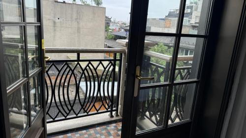 a view of a balcony from an open door at Liban Hotel in Xi'an