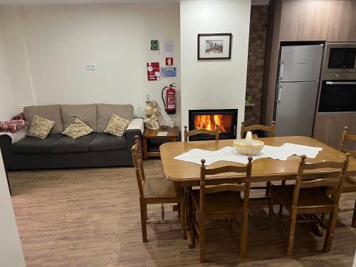 a living room with a table and a couch at Casa do Canto in Macedo de Cavaleiros