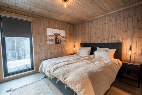 Postel nebo postele na pokoji v ubytování Cozy Family Cabin Ski centre, shuttle bus