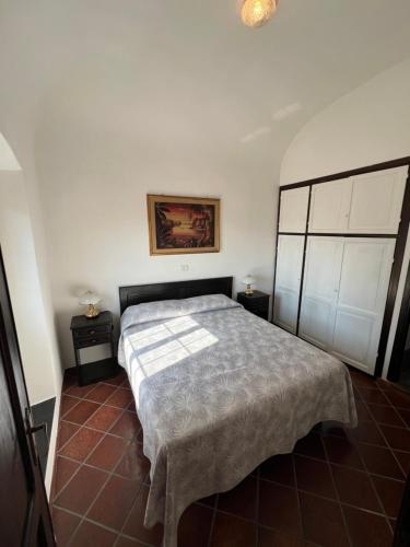 Ένα ή περισσότερα κρεβάτια σε δωμάτιο στο Paradiso sul mare - Finale Ligure