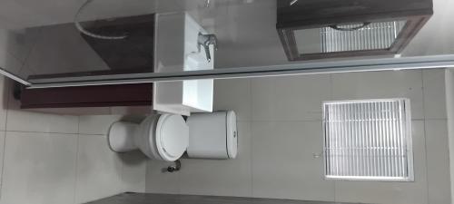a bathroom with a sink and a mirror on the wall at Solomon's Nest in Glencairn