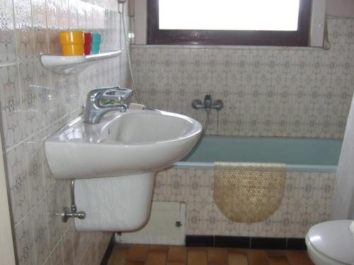 a bathroom with a sink and a toilet at Bij het station van Drongen in Ghent