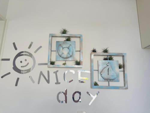 three picture frames on a wall with plants in them at Naha Airport, beaches, shopping centers are nearby #NewVilla in Itoman