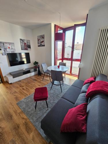 a living room with a couch and a table at Rubin Stay-Karabas Apartments in Vicenza