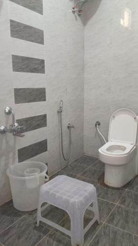 a bathroom with a toilet and a bath tub at Chill Breeze Paradise in Yelagiri