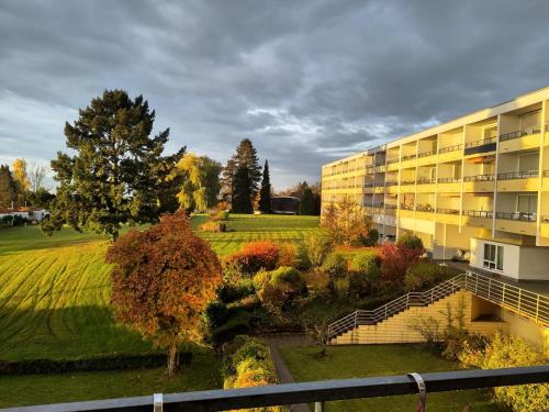 an apartment building with a garden in front of it at Ferienzentrum Bodensee in Oberteuringen