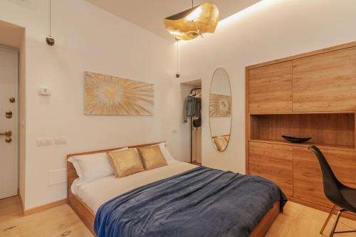 Un pat sau paturi într-o cameră la Casa Indipendenza