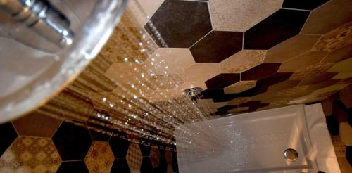 a bathroom with a tile ceiling and a sink at Locanda Fra Diavolo in Diano Marina
