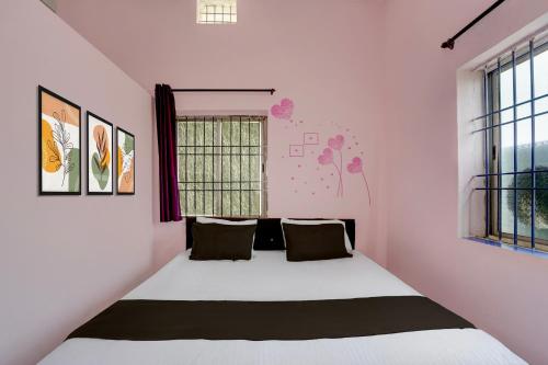 a bedroom with a large white bed in a room at Hotel O Royal Stay in Bhilai