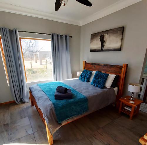 Postel nebo postele na pokoji v ubytování Oryx Lodge