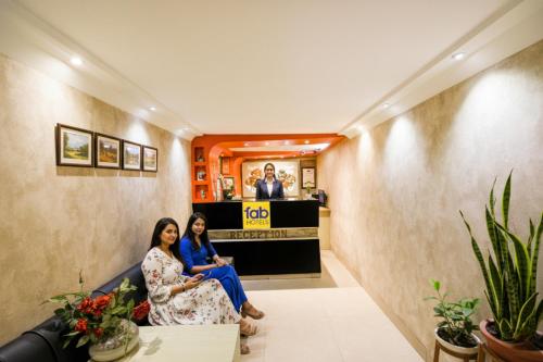 two women sitting in the lobby of a salon at FabHotel Nanda - Nr Ludhiana Junction Railway Station in Ludhiana