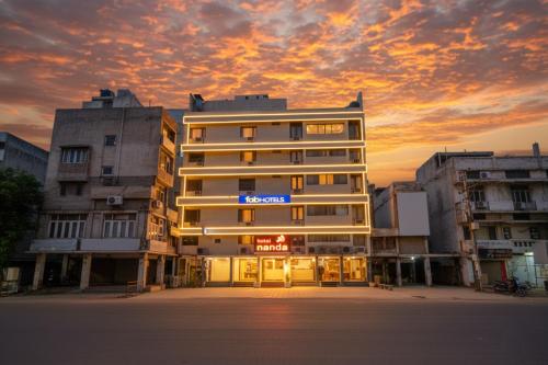 a building with a sign on the front of it at FabHotel Nanda - Nr Ludhiana Junction Railway Station in Ludhiana