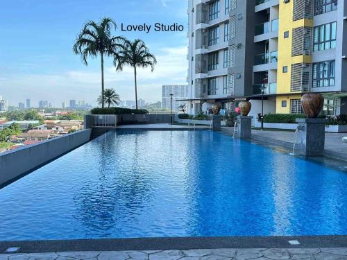 a large swimming pool on the roof of a building at Family Suite -3R2B, Upto8pax, 2 Car Park, Netflix, Nearby The Mines, UPM in Serdang
