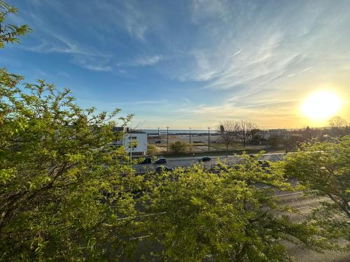 a view of a parking lot with the sun in the sky at Lisbon Riverview Apartment by Premium Lisbon Stays in Lisbon