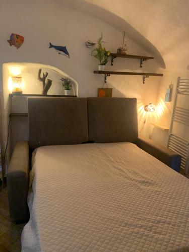 a bedroom with a large bed in a room at Casa Delfino in Sanremo