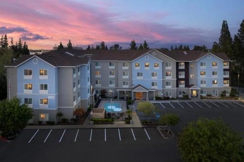 an aerial view of a hotel with a parking lot at TownePlace Suites Sacramento Cal Expo in Sacramento