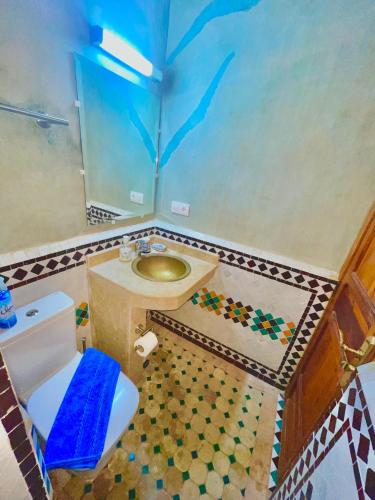 a bathroom with a sink and a toilet in it at RIAD LALJ Fes in Fez
