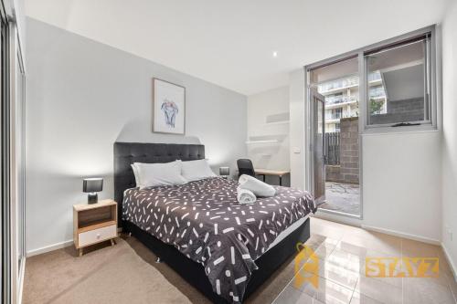 Postel nebo postele na pokoji v ubytování Pretty Penthouse - Close to ANU